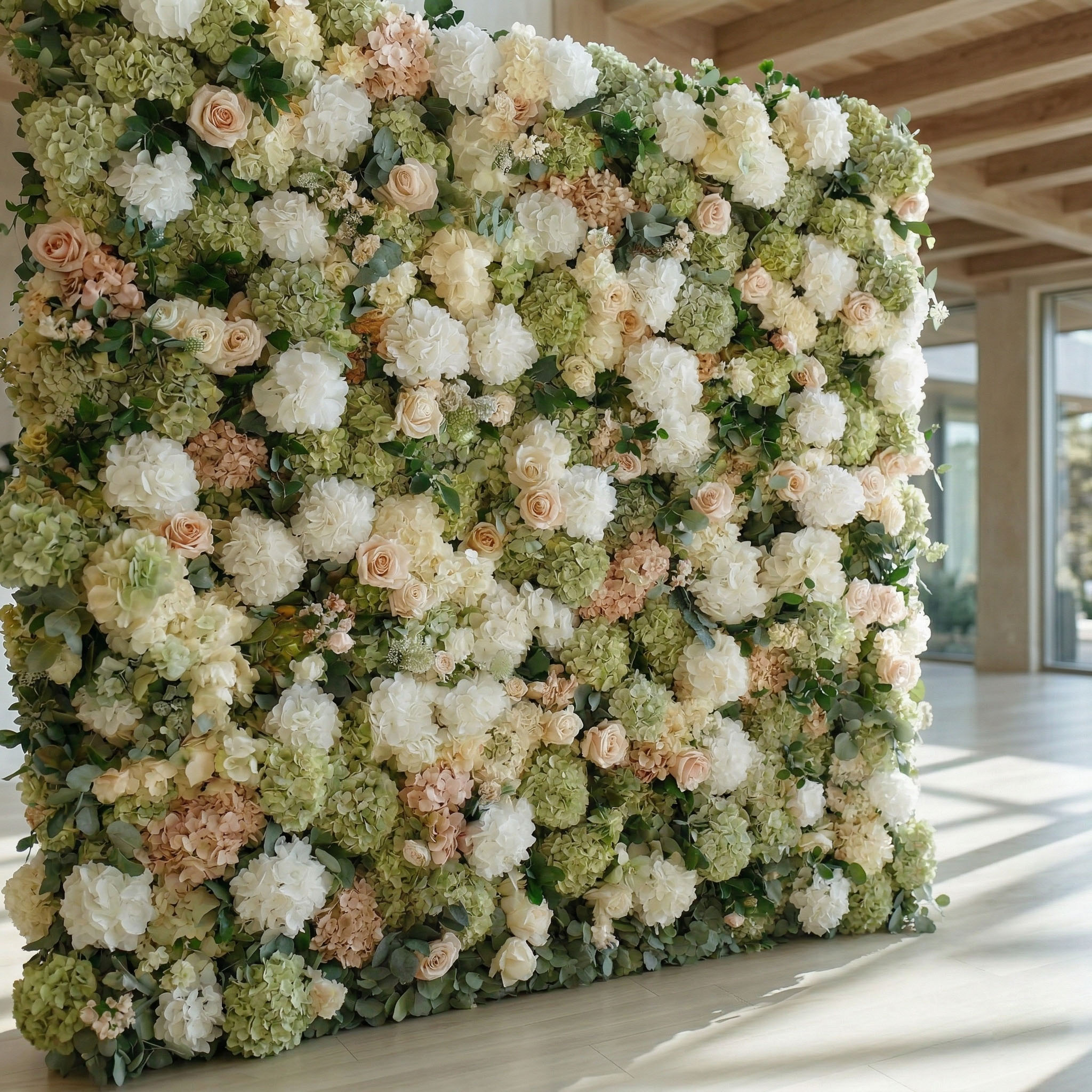Sage green hydrangea flower wall backdrop with ivory and blush accents